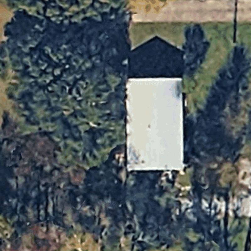 The homeowner's backyard as the satellite image of their address shows it, before the design