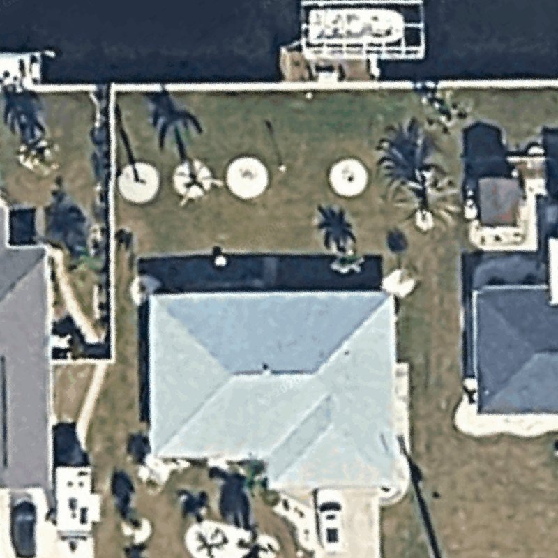 The homeowner's backyard as the satellite image of their address shows it, before the design